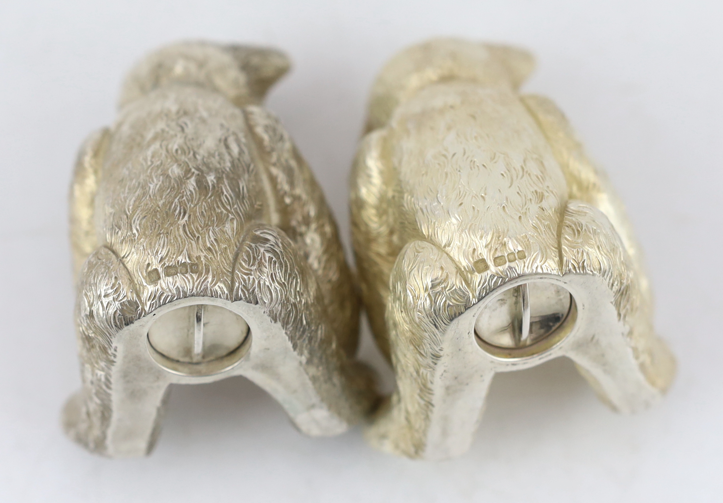 A pair of Elizabeth II cast silver novelty condiments, each modelled as a seated teddy bear